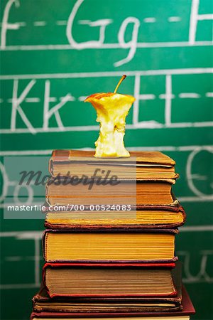 Apple Core on Stack of Books