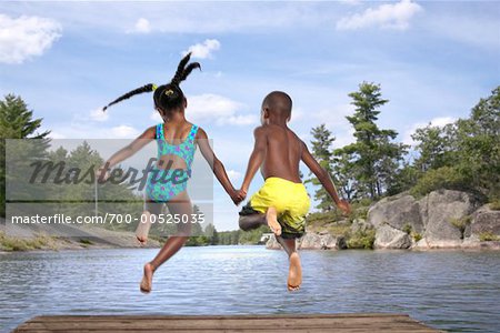 Children Jumping into Lake