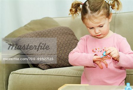 Girl Applying Nail Polish