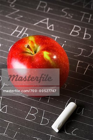 Apple and Chalk on Blackboard