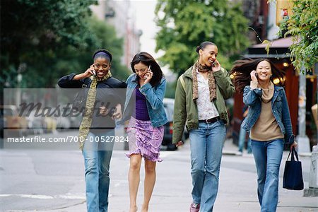 Group of Friends Talking on Their Cellphones