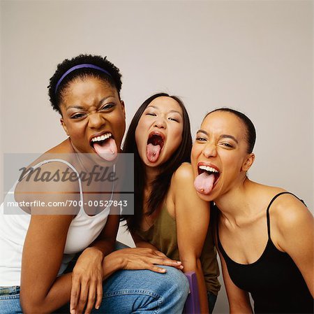 Women Sticking their Tongues Out