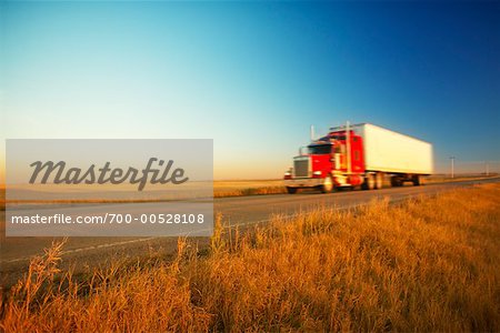 Transport Truck Driving at Dusk