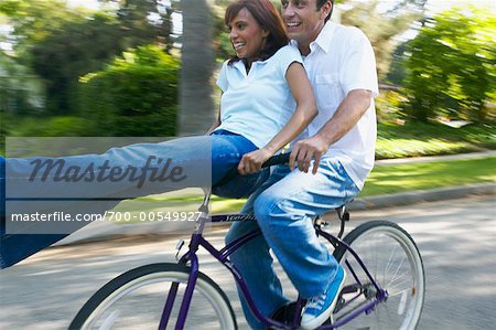 Riding on the handlebars of store a bike