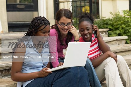 Teenagers Using Laptop Computer