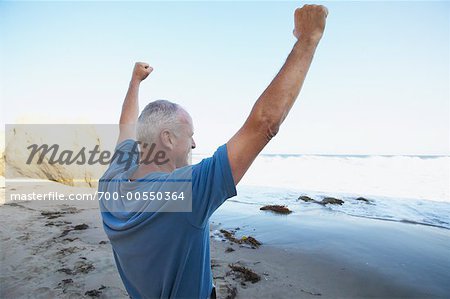 Man Cheering on Beach