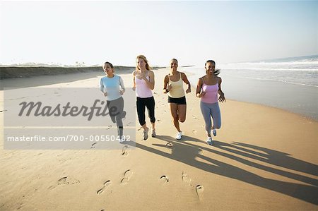 Women Jogging On The Beach