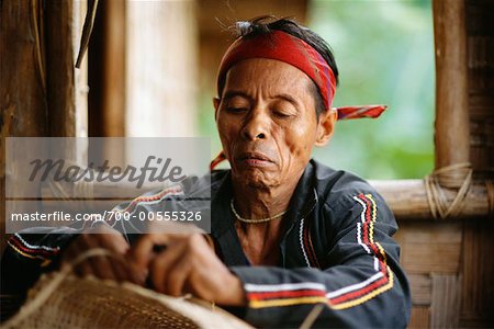 Man weaving a basket Stock Photos and Images