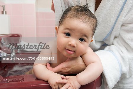 Baby Having Bath in Sink