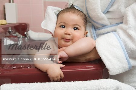 Baby Having Bath in Sink