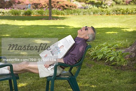 Man Sleeping in Backyard