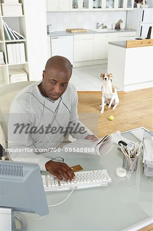Man in Home Office with Dog