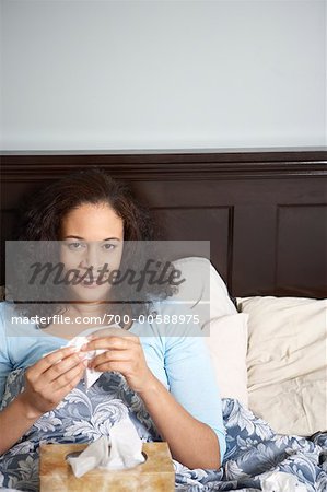 Woman Sick in Bed