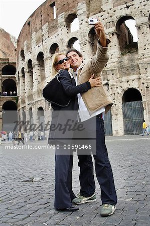 Couple Taking Self Portrait by Colosseum, Rome, Italy
