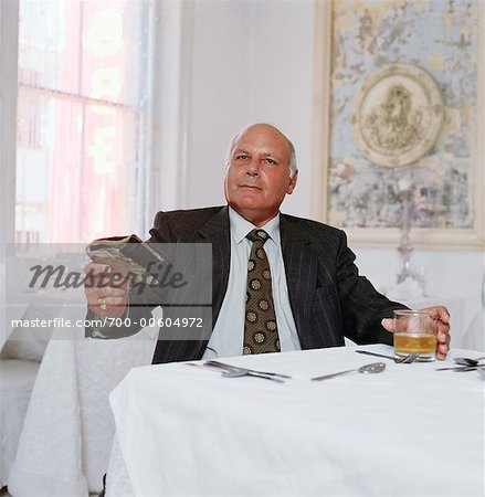 Man Paying at Restaurant