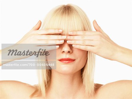 Woman Covering Eyes with Hands