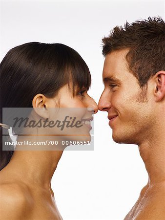 A Woman and Man Facing Each Other