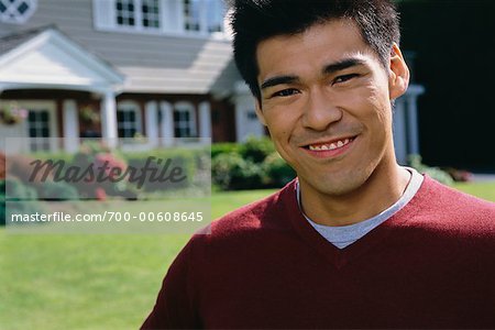 Man in Front of New House