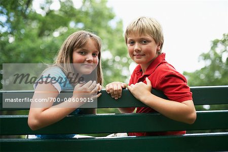 Children Sitting on Park Bench