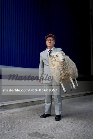 Man Carrying Sheep