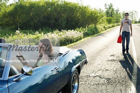 Woman in Stalled Car Waiting for Man