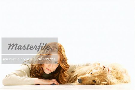 Portrait of Woman Lying Down With Her Dog