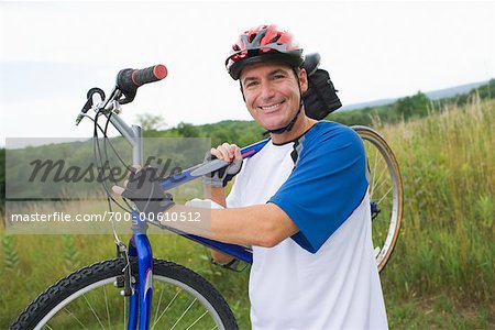 Man Carrying Bike