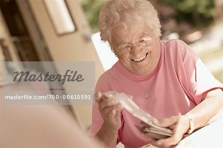 Senior Woman Shuffling Cards