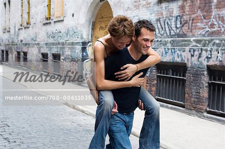 Man Carrying Woman on Back