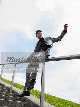 Man Sliding Down Railing Stock Photo Masterfile Rights