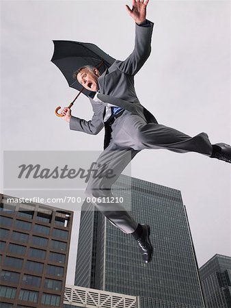 Businessman Falling, Holding Umbrella