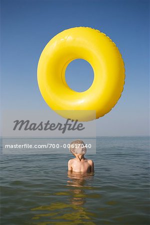 Boy in Water with Inner Tube