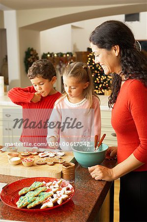 Mother and Children Decorating Christmas Cookies