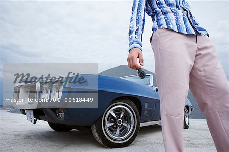 Person Standing in Front of Car
