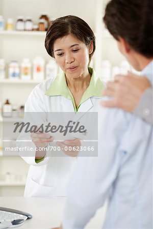 Pharmacist Helping Customers