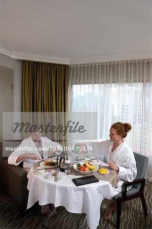 Couple Eating Breakfast in Hotel Room