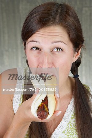 woman eating hot dogs