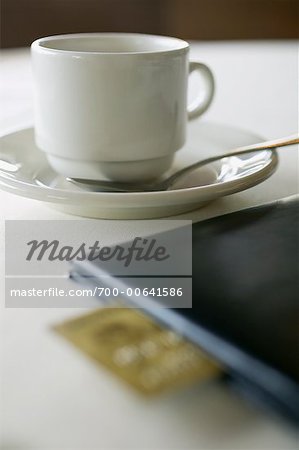 Coffee Cup and Cheque Book at Restaurant