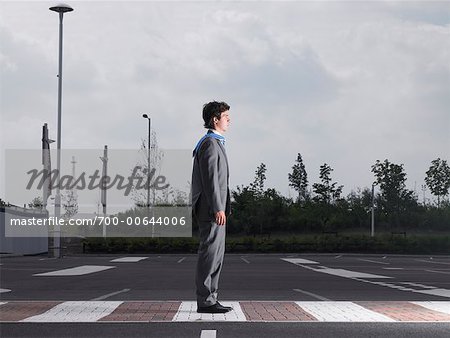 Businessman Standing in Parking Lot