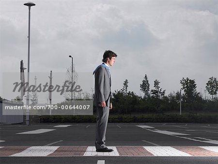 Businessman Standing in Parking Lot