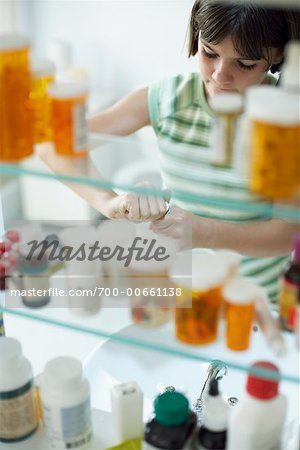 Girl Looking in Medicine Cabinet, Opening Pill Bottle