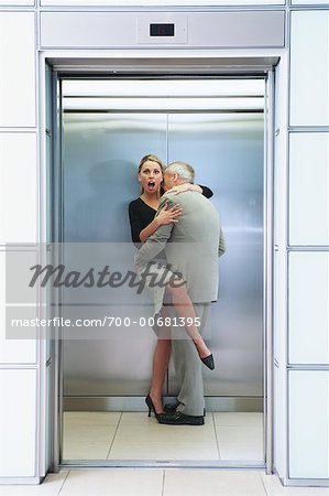Couple in Elevator Embracing