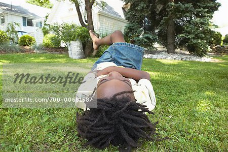 Boy Lying On The Grass