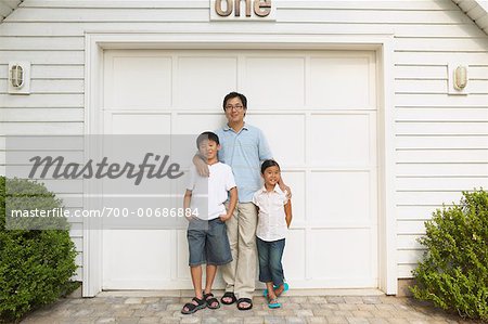 Father With Son And Daughter By Garage Stock Photo Masterfile