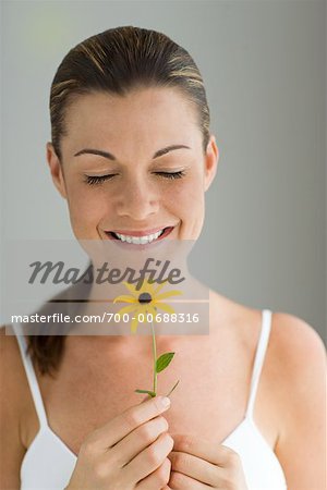 Potrait of Woman Holding a Flower