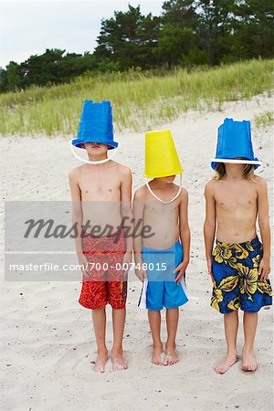 Boys With Buckets Over Heads