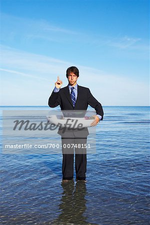 Businessman Wearing Floatation Device