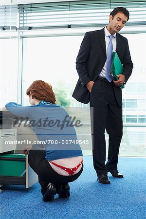 Man Staring at Co-Worker's Underwear - Stock Photo - Masterfile