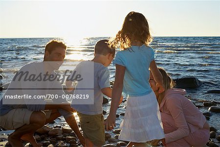 Family on Rocky Shoreline