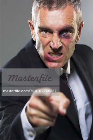 Angry Businessman with Bruised Face